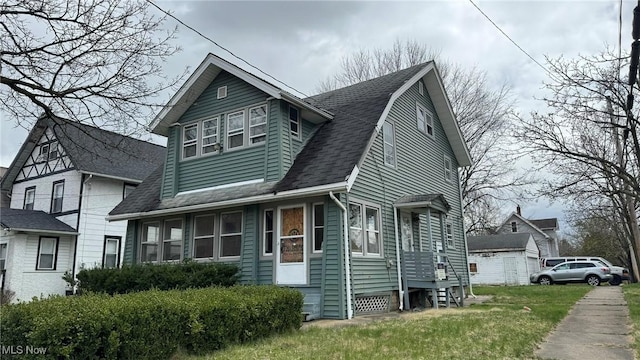 view of front facade featuring roof with shingles