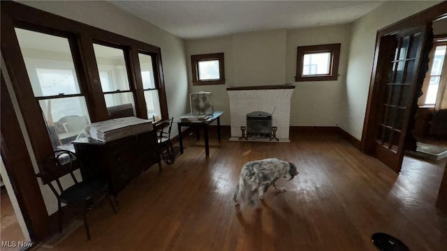 interior space featuring wood finished floors and baseboards