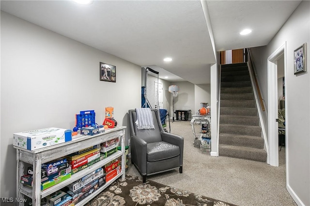 sitting room with stairway, recessed lighting, baseboards, and carpet floors