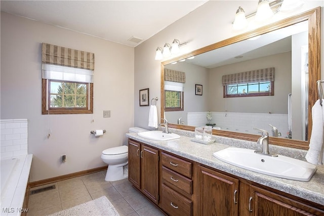 full bathroom with tile patterned flooring, toilet, visible vents, and a sink