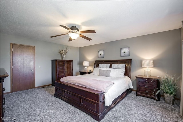 bedroom featuring baseboards, light carpet, a textured ceiling, and a ceiling fan