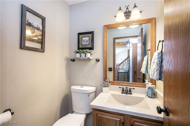 half bath with vanity and toilet