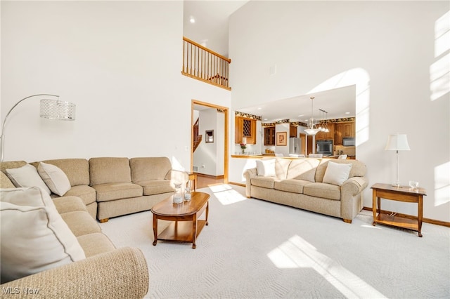 living room featuring a high ceiling, recessed lighting, baseboards, and light carpet