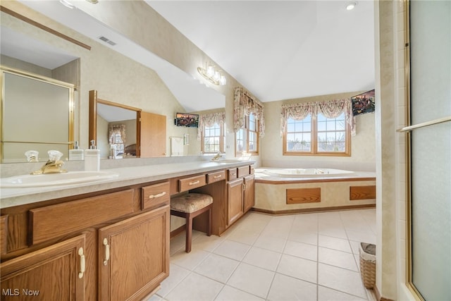 full bath featuring a shower stall, lofted ceiling, a bath, tile patterned floors, and a sink