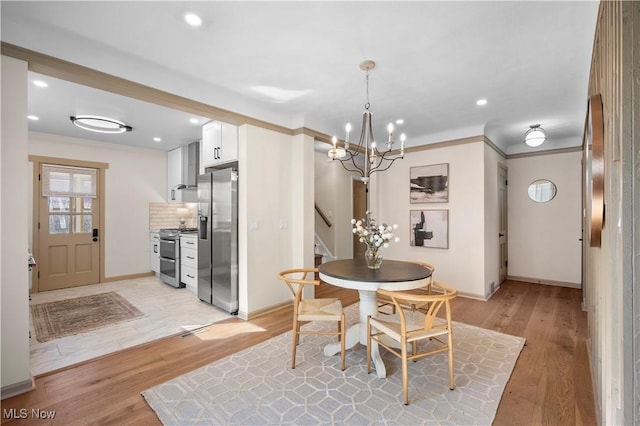 dining area with recessed lighting, light wood-style flooring, stairs, and ornamental molding