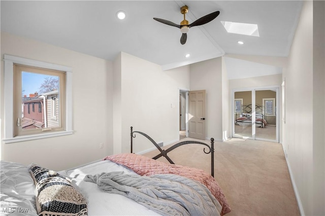 bedroom with recessed lighting, baseboards, lofted ceiling with skylight, and carpet floors