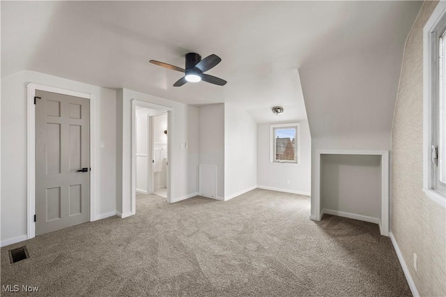 additional living space featuring visible vents, baseboards, and carpet