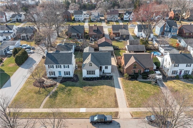 birds eye view of property with a residential view