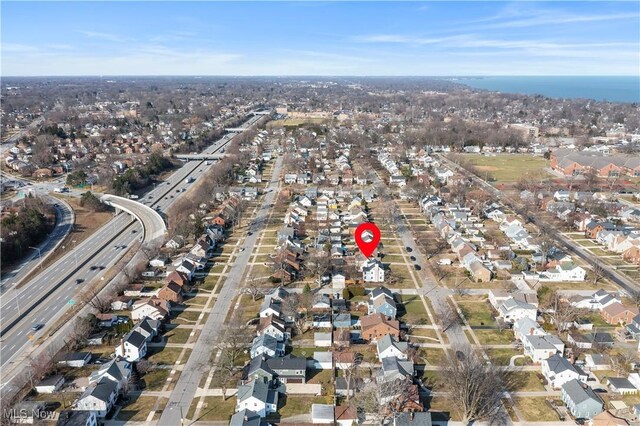 birds eye view of property with a residential view