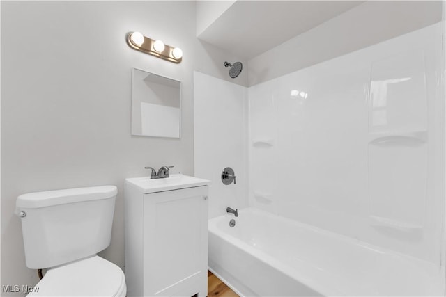 bathroom with vanity, toilet, and washtub / shower combination