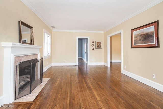 unfurnished living room featuring baseboards, visible vents, a fireplace with flush hearth, dark wood-style flooring, and crown molding