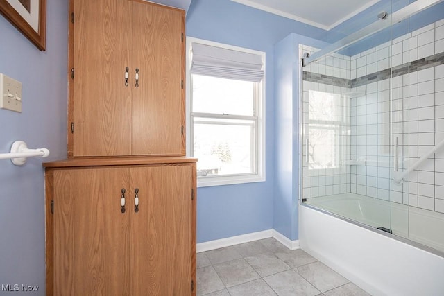 full bathroom featuring tile patterned flooring, baseboards, combined bath / shower with glass door, and ornamental molding