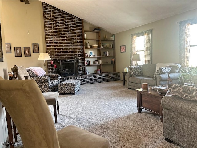 carpeted living area with a fireplace and lofted ceiling