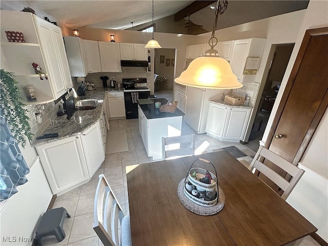 kitchen with a kitchen island, vaulted ceiling with beams, decorative backsplash, under cabinet range hood, and black electric range oven