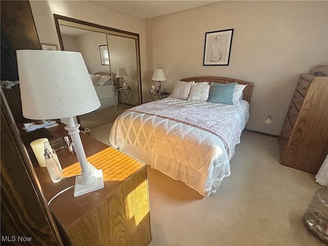 bedroom with a closet and carpet flooring