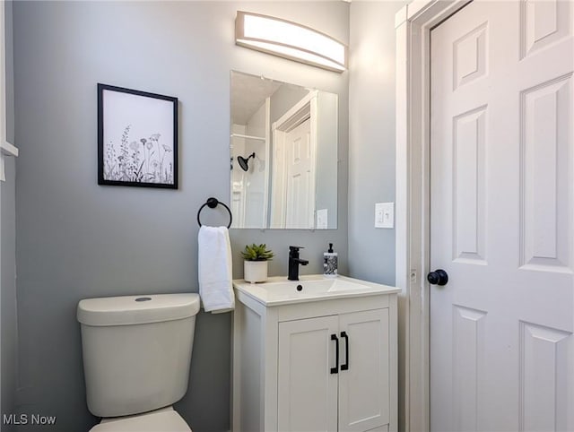 bathroom with toilet and vanity