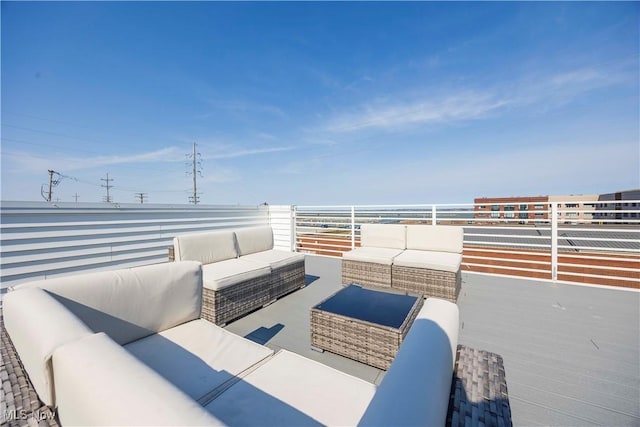 view of patio with outdoor lounge area and a balcony