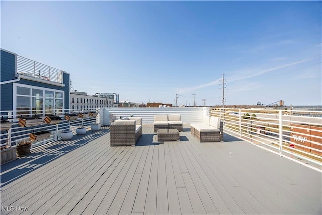 wooden terrace featuring an outdoor living space