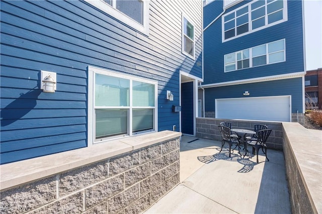 view of patio / terrace with a garage