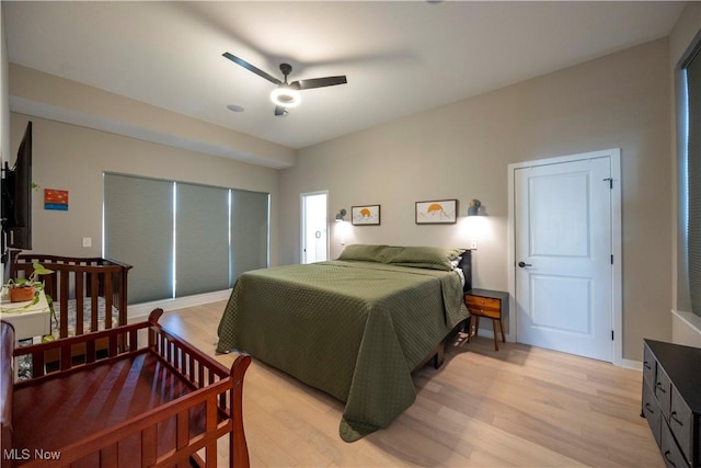 bedroom with light wood-style floors and ceiling fan