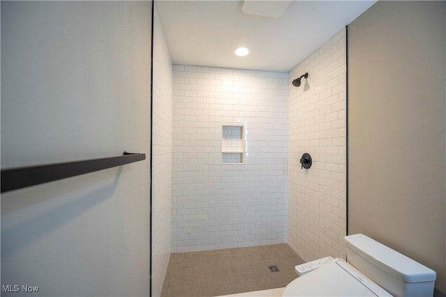 full bathroom featuring toilet, recessed lighting, and a stall shower