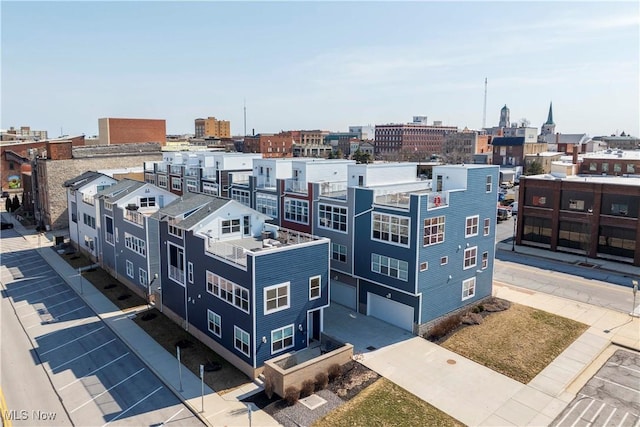 birds eye view of property with a view of city