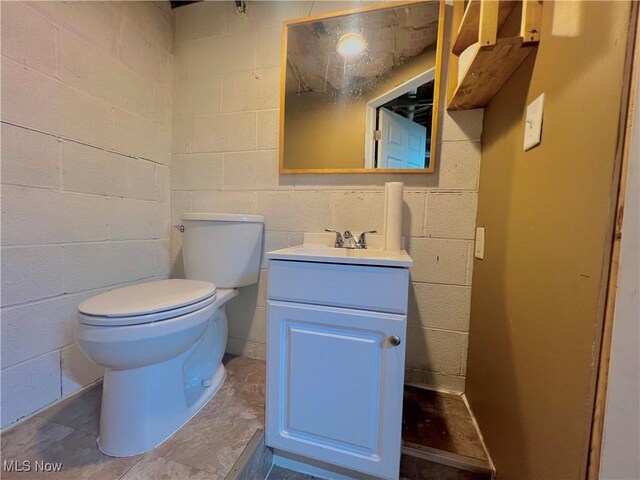 bathroom featuring toilet and vanity