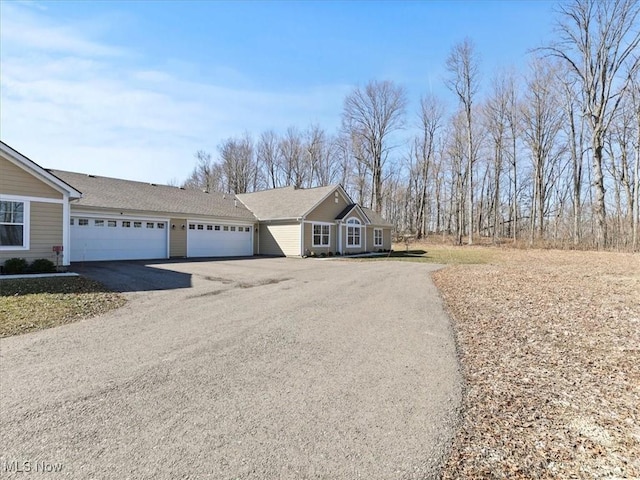 view of front of home featuring a garage and driveway