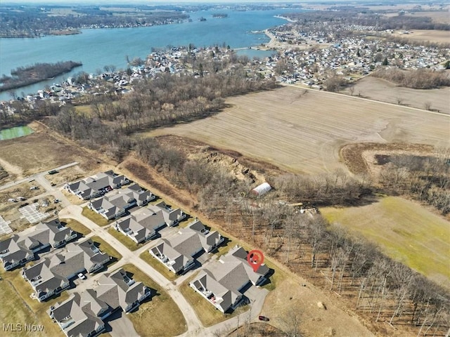 bird's eye view with a residential view and a water view