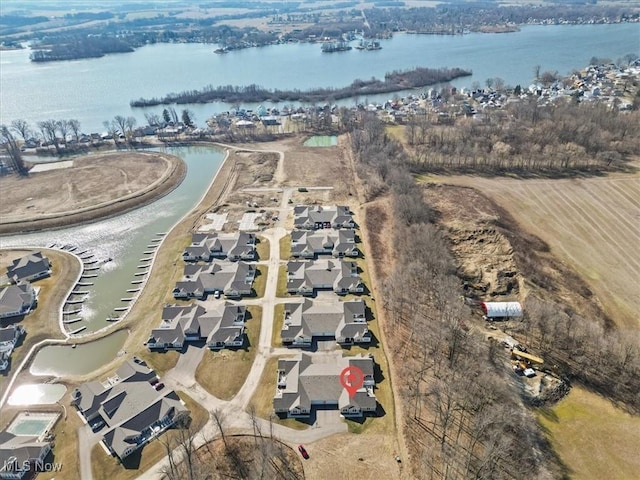 bird's eye view featuring a residential view and a water view