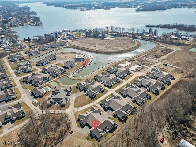 birds eye view of property with a residential view and a water view