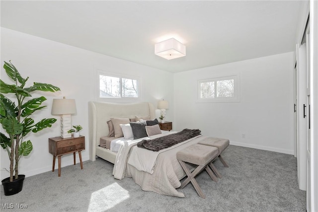 bedroom featuring baseboards and carpet floors