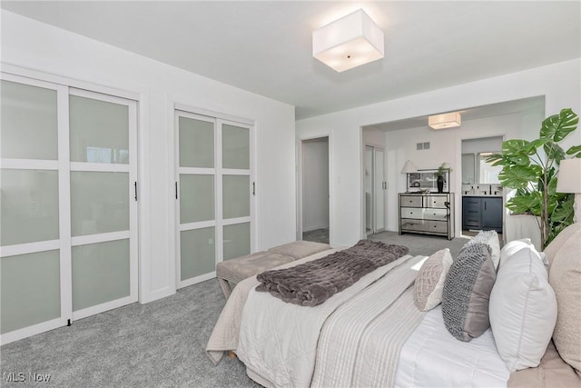 bedroom featuring visible vents and carpet floors