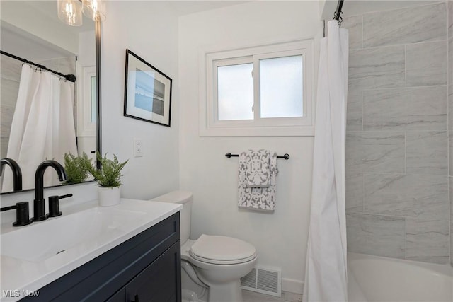 bathroom featuring vanity, toilet, shower / bath combo, and visible vents