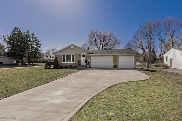 view of front of home featuring a front yard, an attached garage, brick siding, and driveway