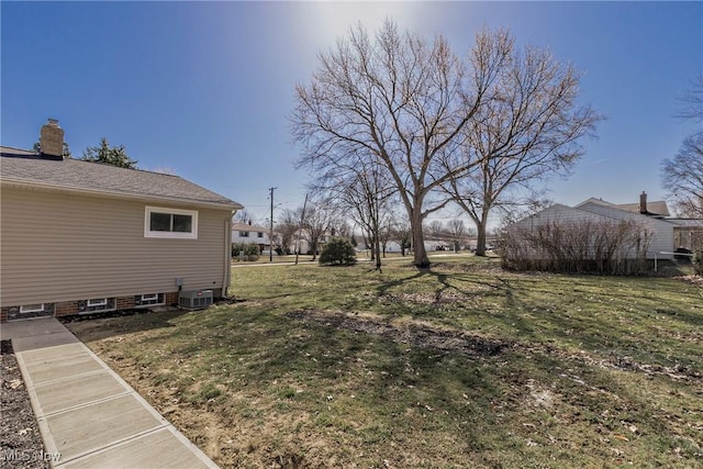 view of yard with central AC