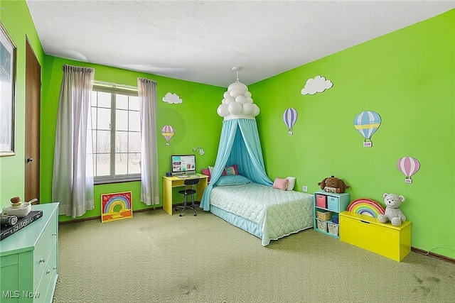 carpeted bedroom featuring baseboards