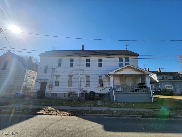 townhome / multi-family property with a porch