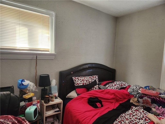 bedroom with a textured wall