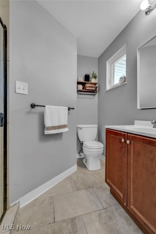 full bath with a shower with shower door, baseboards, toilet, and vanity