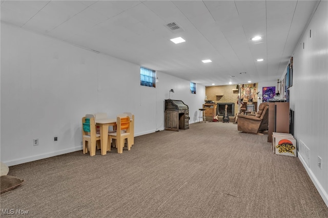 playroom featuring visible vents, carpet floors, baseboards, recessed lighting, and a brick fireplace