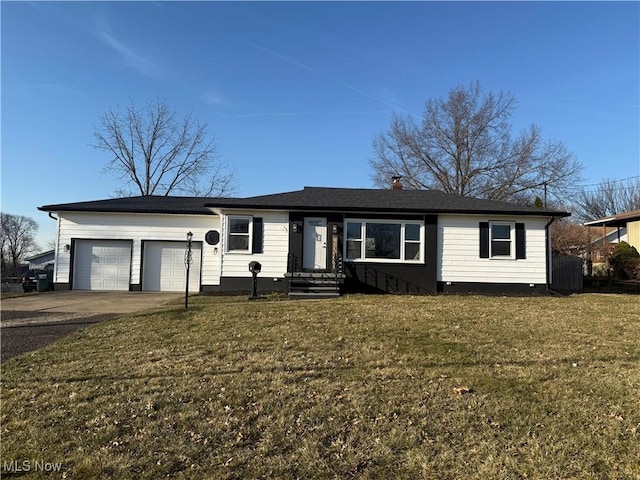 single story home featuring a garage, a front lawn, and driveway