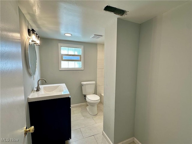 bathroom featuring vanity, visible vents, baseboards, tile patterned flooring, and toilet