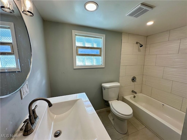 bathroom featuring visible vents, plenty of natural light, a sink, tile patterned flooring, and toilet