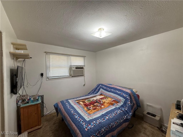 carpeted bedroom featuring a textured ceiling