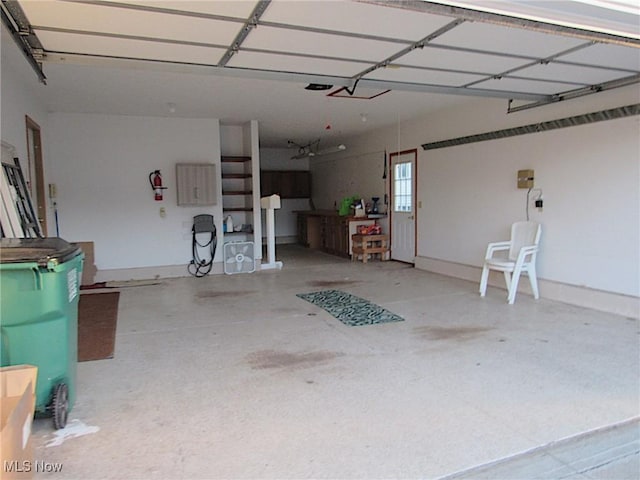 garage featuring baseboards