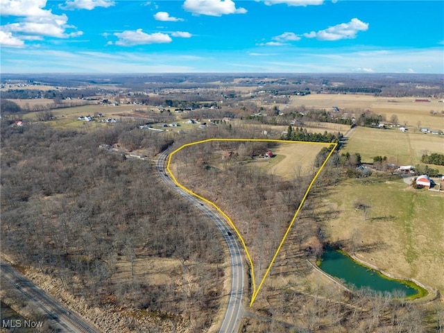 aerial view with a rural view and a water view