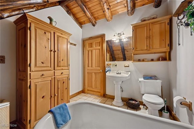 bathroom with a bath, vaulted ceiling with beams, tile patterned flooring, wood ceiling, and toilet