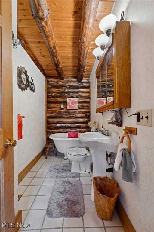 bathroom with baseboards, toilet, beam ceiling, wooden ceiling, and tile patterned floors