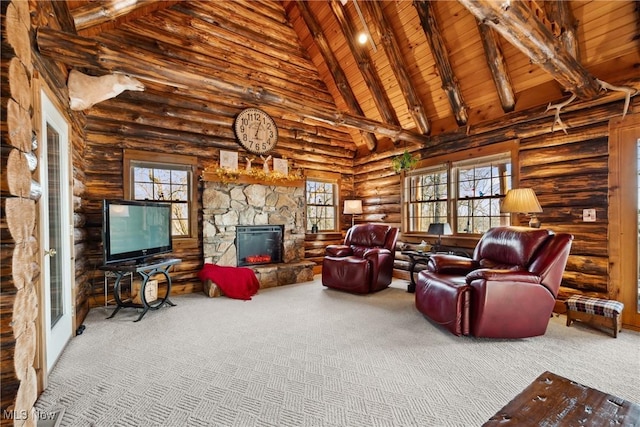 carpeted living room with plenty of natural light, beamed ceiling, a fireplace, and wooden ceiling